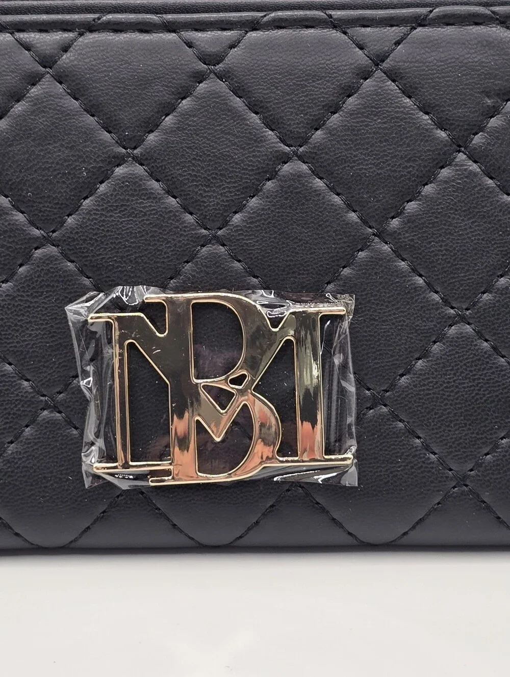 Badgley Mischka new wallet flaws